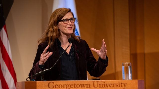 Samantha Power giving a speech at a Georgetown University podium