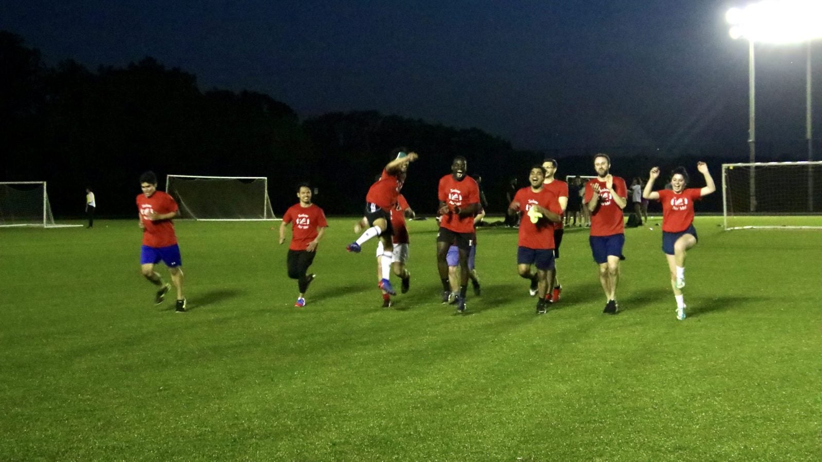 GHD soccer team running toward the camera and celebrating