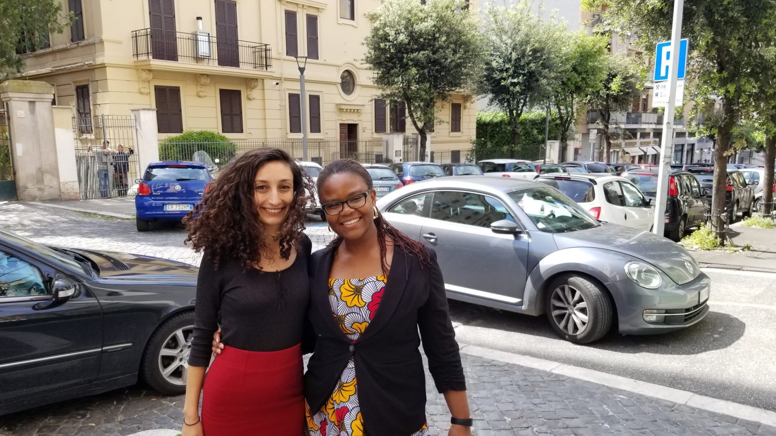 Foluyinka and her GHD capstone partner standing on a street in Rome