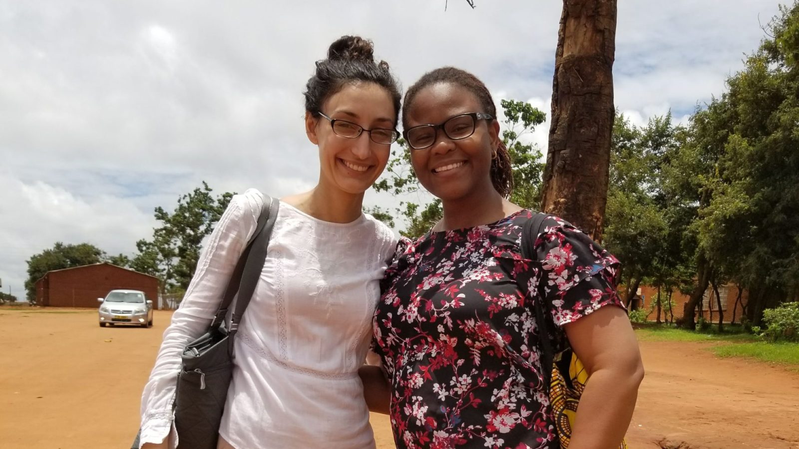 Foluyinka and her GHD Capstone partner standing outside in Malawi